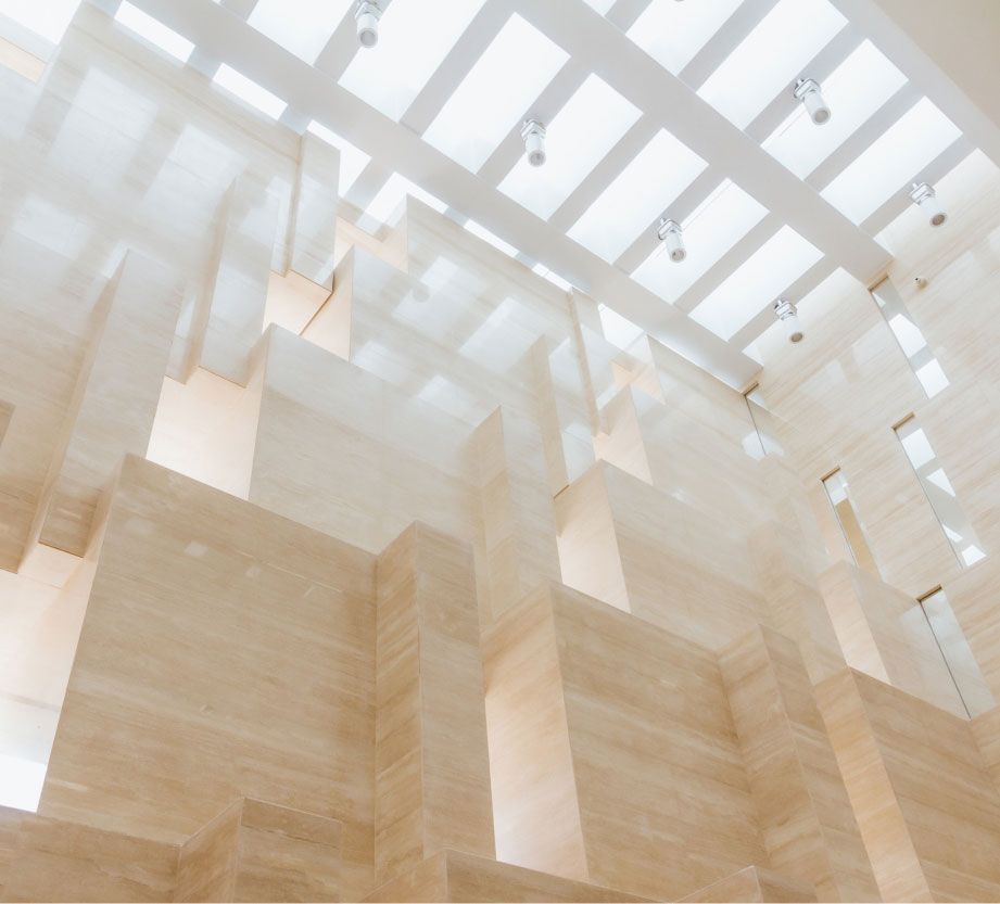 Contemporary and airy wall fixtures looking towards the bright ceiling.